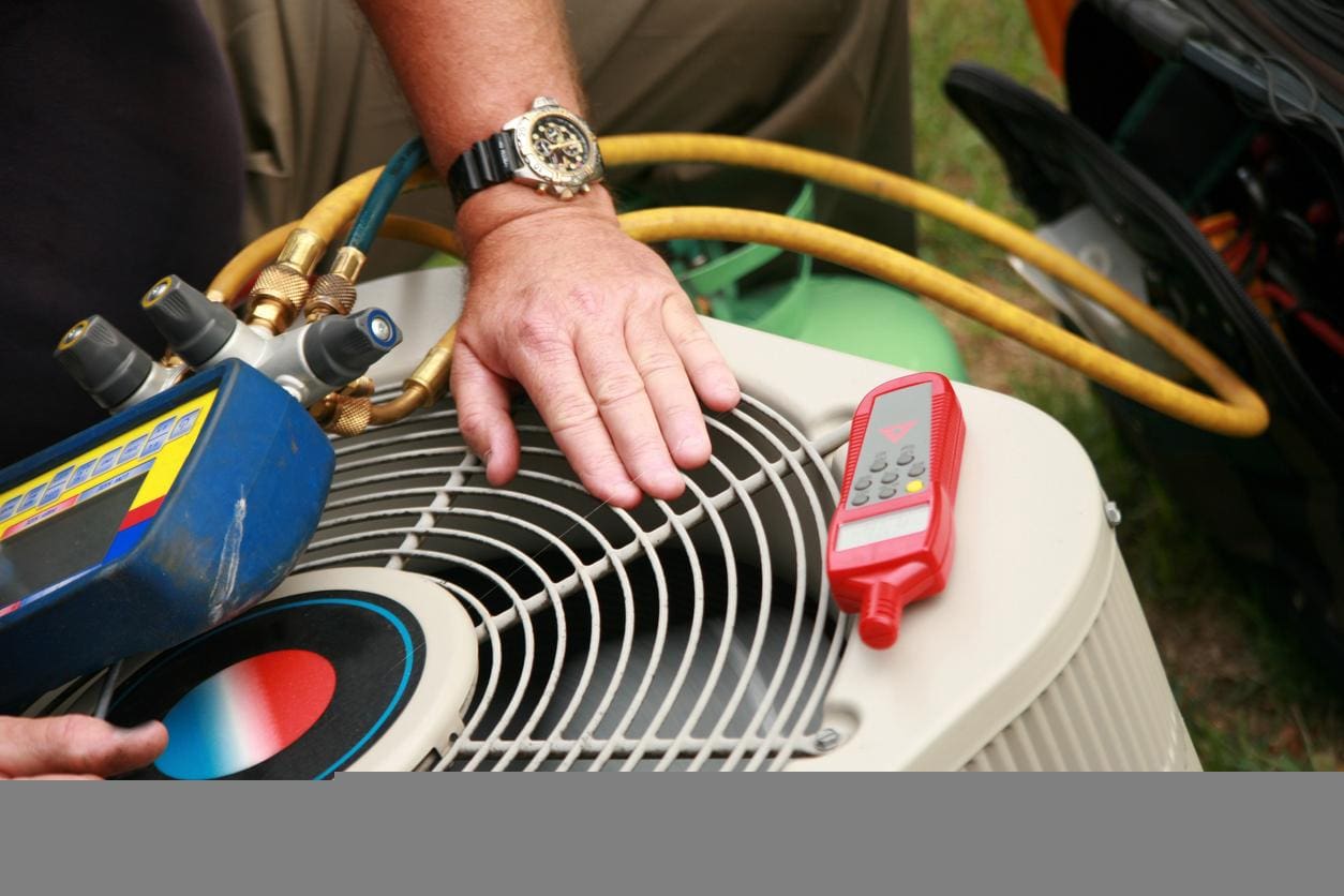 Technician Working on AC Unit