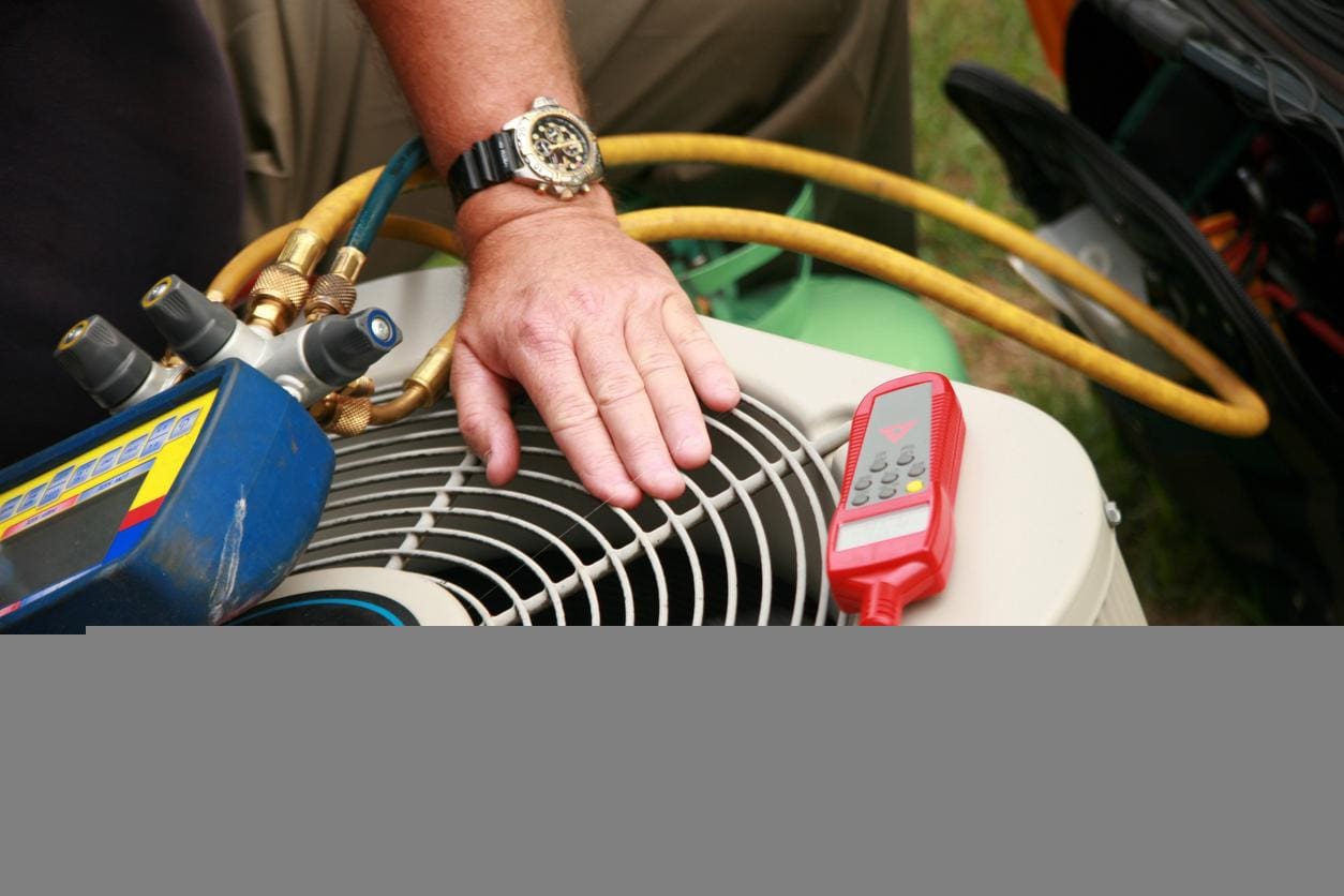 Technician Working on AC Unit