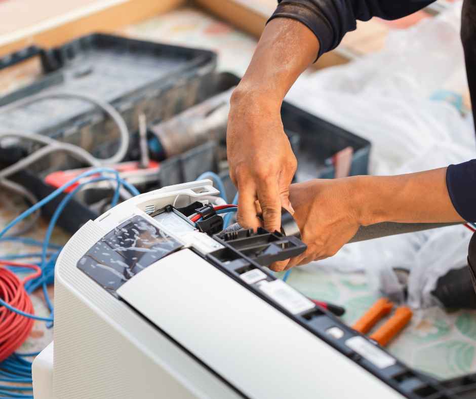 Working on an air conditioner